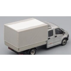1:43 Масштабная модель ГАЗель NEXT A22R33 бортовой с тентом и обтекателем, серебристый